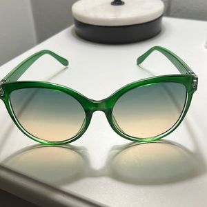 Green frame shade glasses. Comes with clear case. New